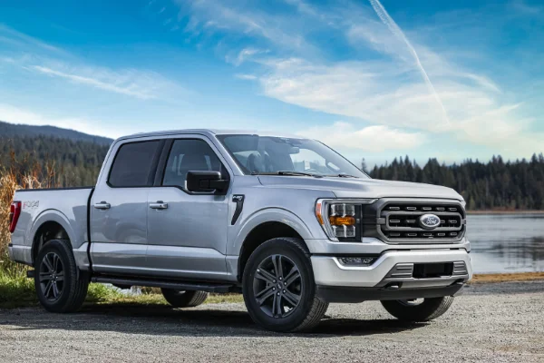 Ford truck driving across the Oregon outdoors after a service with Uncle Al's.