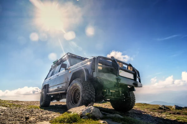 Jeep driving across the Oregon outdoors after a service with Uncle Al's.