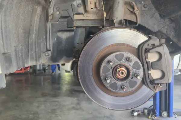 car on risers for check of disc brakes